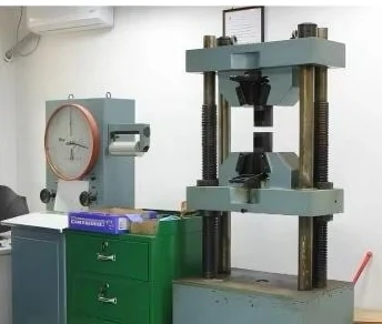 A tensile testing machine used to evaluate the mechanical performance of metal parts.
